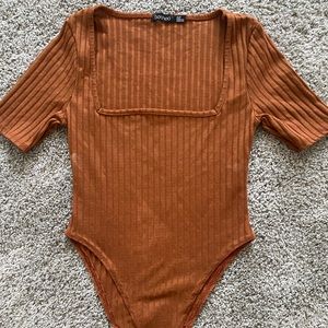 Brown bodysuit.